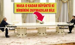 Görüşme devasa masanın gölgesinde kaldı